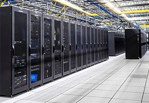A row of black server cabinets lined up in a data center, featuring organized cables and a clean, spacious floor layout.