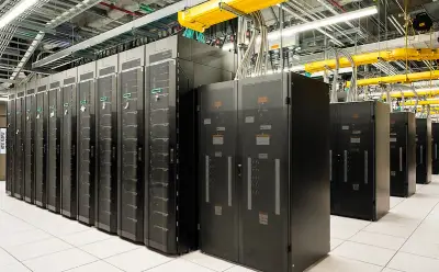 A row of dark server racks in a data center, featuring organized cables and modern cooling systems in a high-tech environment.